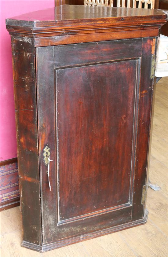 A dark wood corner cupboard W.71cm